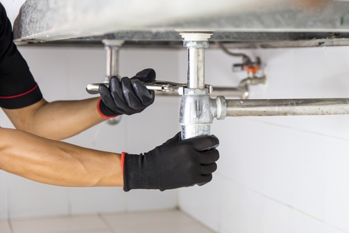 Repairing a water pipe under the sink